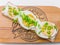 Breakfast open sandwich with soft cream cheese ricotta, egg, green onion. Top view