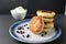 Breakfast pancakes cheesecakes are stacked slide on a plate with blueberries blueberries cherries. Traditional breakfast Russian