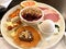 Breakfast Plate with Blackberry Granola, Yogurt, Mozzarella, Pancake, Crispbread, Smoked Beef, Ham and Blood Orange