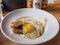 Breakfast Plate with Fried Eggs and Sausage at Cochon Butcher Restaurant