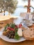 Breakfast Plate with Watermelon, Cheese, Walnuts, Olives, Butter, Jam, Tomato Slice, Wheat Bread Slice and Coffee in Sea View Rest