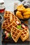 Breakfast platter with waffles, berries and chicken