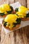Breakfast of poached eggs with spinach and hollandaise sauce on bread close-up. vertical