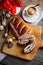 Breakfast poppy cake with cup of coffee on breadboard, flowers, red poppy, sweet baked dessert, espresso