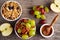 Breakfast prep with toasted oat clusters, juicy raisins, banana and pineapple chunks grapes pecan nut.