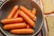 Breakfast preparation, sausage and buttered bread.