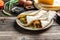 Breakfast quesadilla with fried eggs, bacon, cheese, Mexican food cuisine traditional dish. Food recipe background. space for text