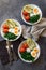 Breakfast quinoa bowls with baked tomatoes, avocado, kale, boiled eggs and greek yogurt