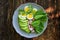 Breakfast salad with radishes, boiled egg and mix lettuce leaves,spinach. Food background. Top view