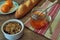 Breakfast scene with coffe, bread, fruits and cake on rustic table