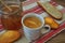 Breakfast scene with coffe, bread, fruits and cake on rustic table