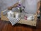 A breakfast is served using a recycled old wooden fruit box as a tray