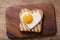 Breakfast with shapped heart fried egg and toasted bread. Valentines day food