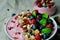 Breakfast Smoothie Bowl with Raspberries, Granola, Blueberries,Goji Berries and Mint.