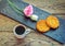 Breakfast or snack â€“ cup of freshly brewed coffee, sesame cookies, pink lisianthus flower
