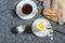 Breakfast. Soft-boiled eggs, cup of coffee and cereal crispbread