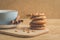 breakfast with stacked chip cookies with nuts and coffee cup/ breakfast with stacked chip cookies with nuts and coffee cup on a