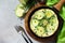 Breakfast. Summer omelet with zucchini and herbs on a stone or slate table