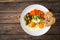 Breakfast - sunny side up egg, toasted bread, sweet potato, mushrooms and olives served on wooden table