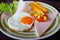 Breakfast with sunny side up fried egg toast sausage fruits vegetable