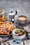 Breakfast table with granola and yogurt, fresh homemade belgian waffles and hot black coffee