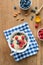 Breakfast table with oatmeal porridge, fresh berries and honey