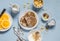 Breakfast table. Whole wheat pancakes, greek yogurt with homemade granola, orange slices, nuts, corn flakes