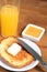 Breakfast: toasts with butter, juice and orange jam