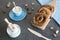 Breakfast with typical Dutch cinnamon bread roll called `Bolus`  and cup of coffee