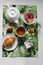Breakfast in white dishes on a colored tablecloth with a croissant