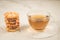 Breakfast whith cookies and glass cup whith tea/Breakfast whith cookies and glass cup whith tea on a white table. Selective focus