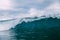 Breaking blue wave. Barrel wave for surfing