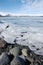 Breaking ice floe, gravel shore, Jokulsarlon, Iceland