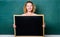 Breaking news. Teacher cheerful woman hold blackboard blank copy space. School information concept. School bell schedule