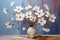 Breaking Through: A Vibrant Still Life of White Flowers and Crac