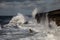 Breaking waves over Holyhead Breakwater