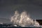 Breaking waves over Holyhead Breakwater