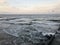 Breaking waves on a wooden breakwater on the Baltic Sea coast.