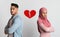 Breakup And Divorce Concept. Collage Of Unhappy Black Couple Standing Back To Back With Ripped Heart Symbol Icon Between