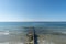 Breakwater on beach. Beautiful seascape. Wooden sea separator. Protection holidaymakers from effects of both weather and longshore