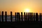 Breakwater on beach at sunset