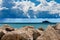 Breakwater with Cumulus Clouds and Torrential Rain over The Sea