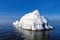 The breakwater in the form of an iceberg in a Sunny winter day.