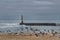 Breakwater and lighthouse of Aguda Beach in Porto