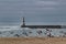 Breakwater and lighthouse of Aguda Beach in Porto