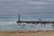 Breakwater and lighthouse of Aguda Beach in Porto