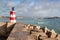 Breakwater with a lighthouse to guide. port Bay Sagres