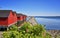 Breakwater line along Red fisher houses in the port Weisse Wiek in Boltenhagen on the Baltic Sea. Germany