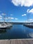 Breakwater and moored yachts from a wooden deck