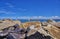 The breakwater pointing out to the horizon line with beautiful clouded skies above. WarnemÃ¼nde